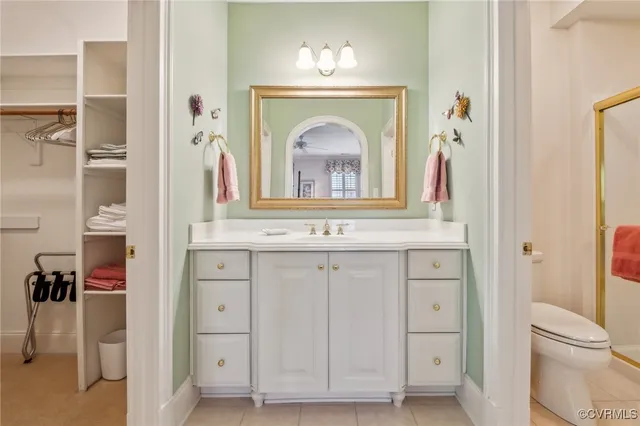 a bathroom with a sink mirror and a shower