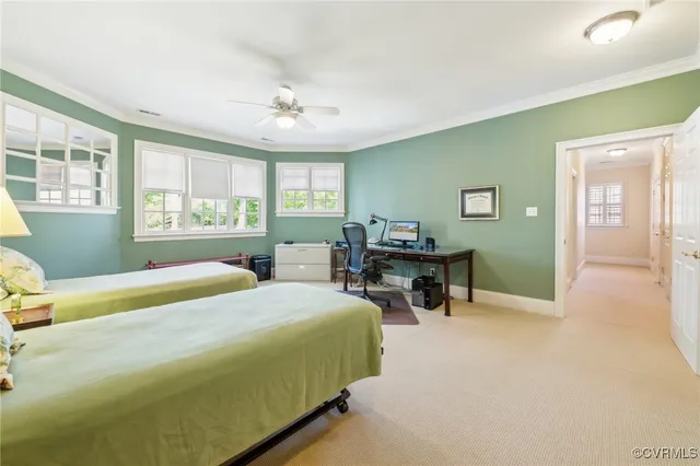 a living room with furniture and a kitchen view