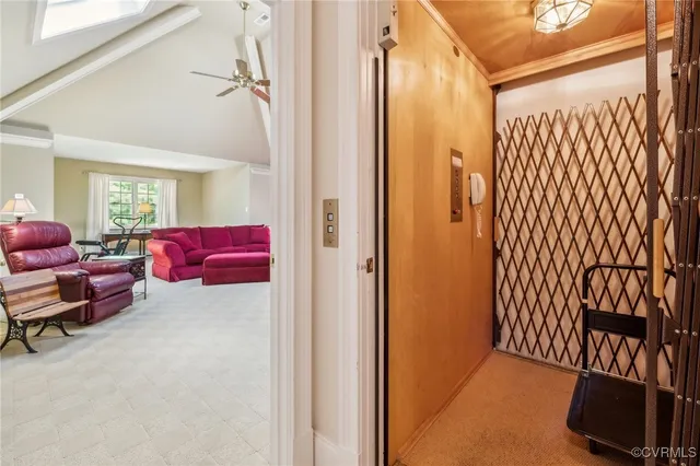 a view of livingroom with furniture and workspace