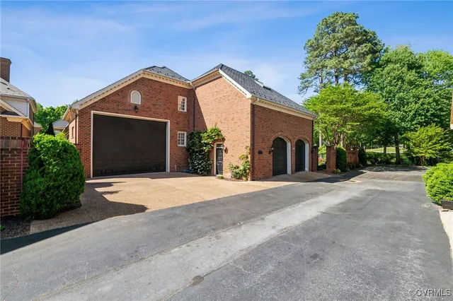 a front view of a house with yard and garage