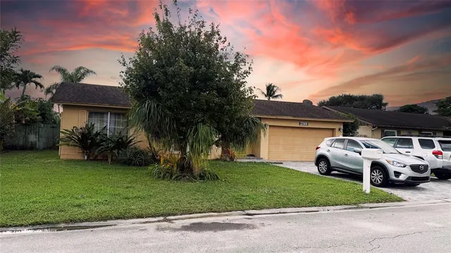 a view of a car parked in front of a house