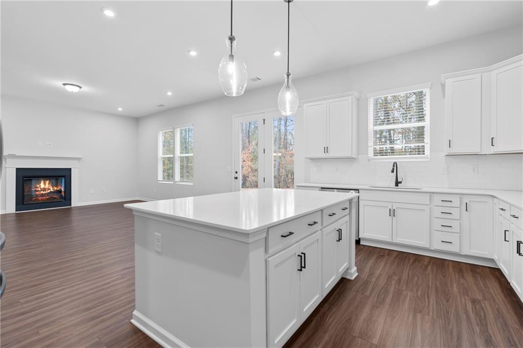 3699 Annsbury Court Lilburn, GA 30047 - Photo 18 of 45 a large white kitchen with a large window a oven and white appliances