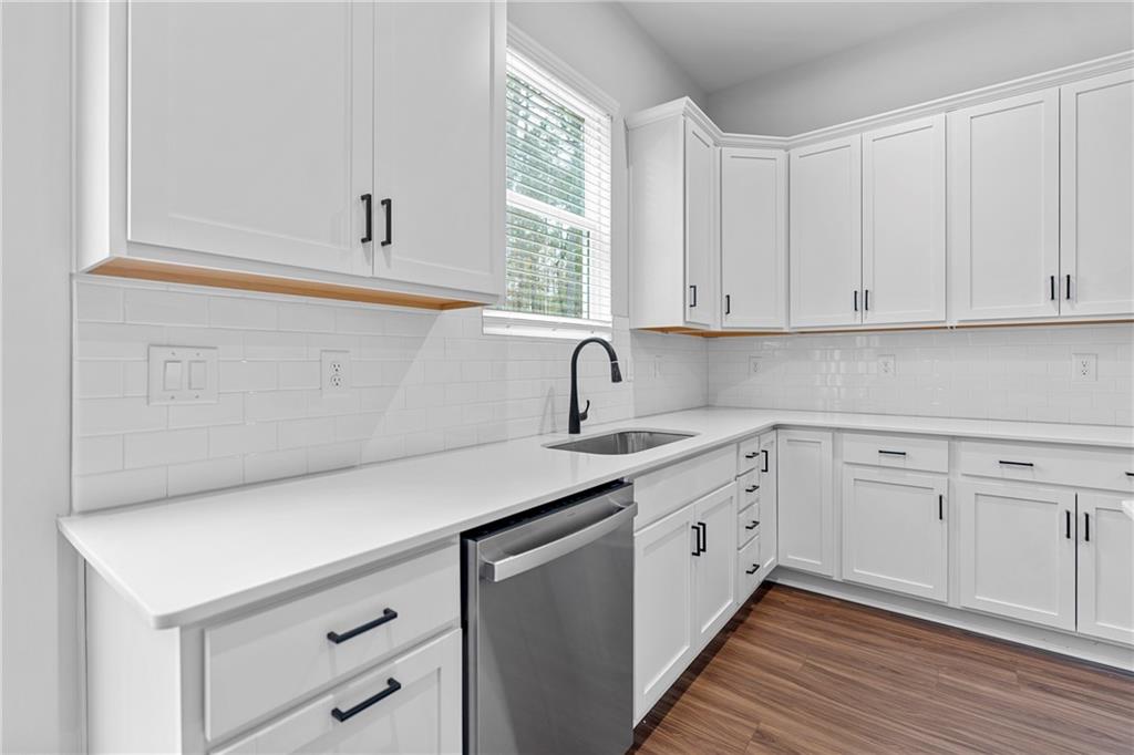 3699 Annsbury Court Lilburn, GA 30047 - Photo 22 of 45 a kitchen with white cabinets and sink