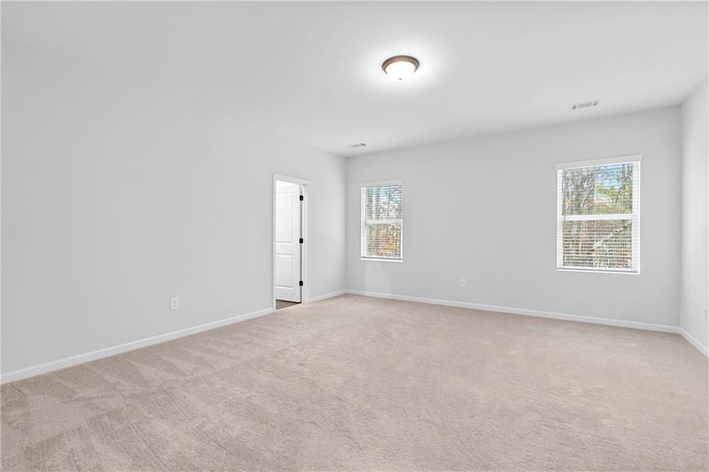 3699 Annsbury Court Lilburn, GA 30047 - Photo 25 of 45 an empty room with windows