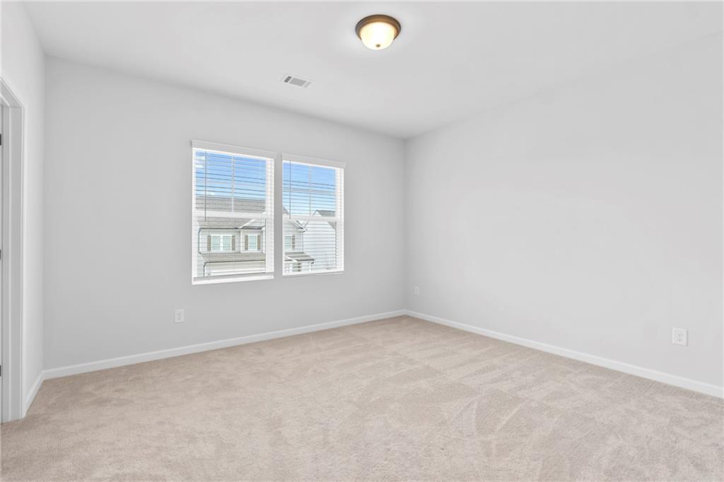 3699 Annsbury Court Lilburn, GA 30047 - Photo 33 of 45 an empty room with windows