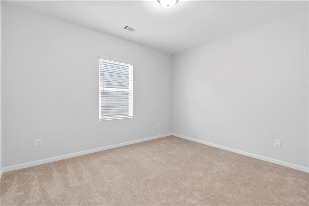 3699 Annsbury Court Lilburn, GA 30047 - Photo 36 of 45 an empty room with a window