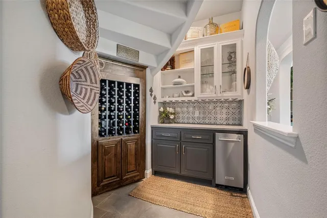 a kitchen with a refrigerator and cabinets