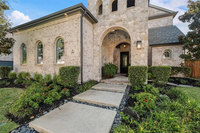a view of a house with a garden