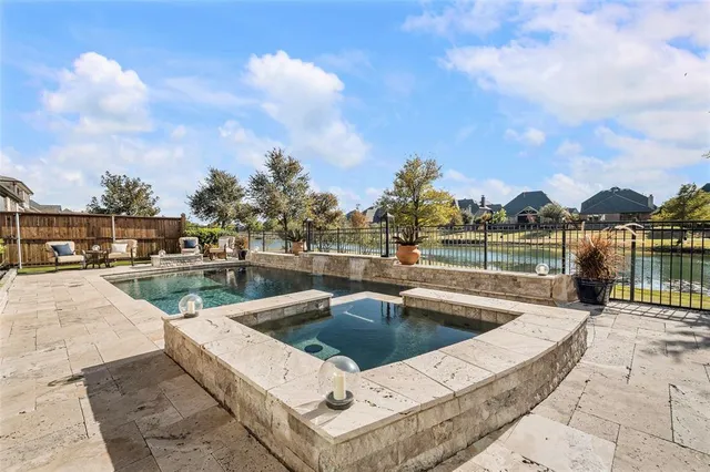 a view of swimming pool with a lounge chair