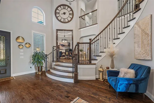 a view of entryway and hall with wooden floor