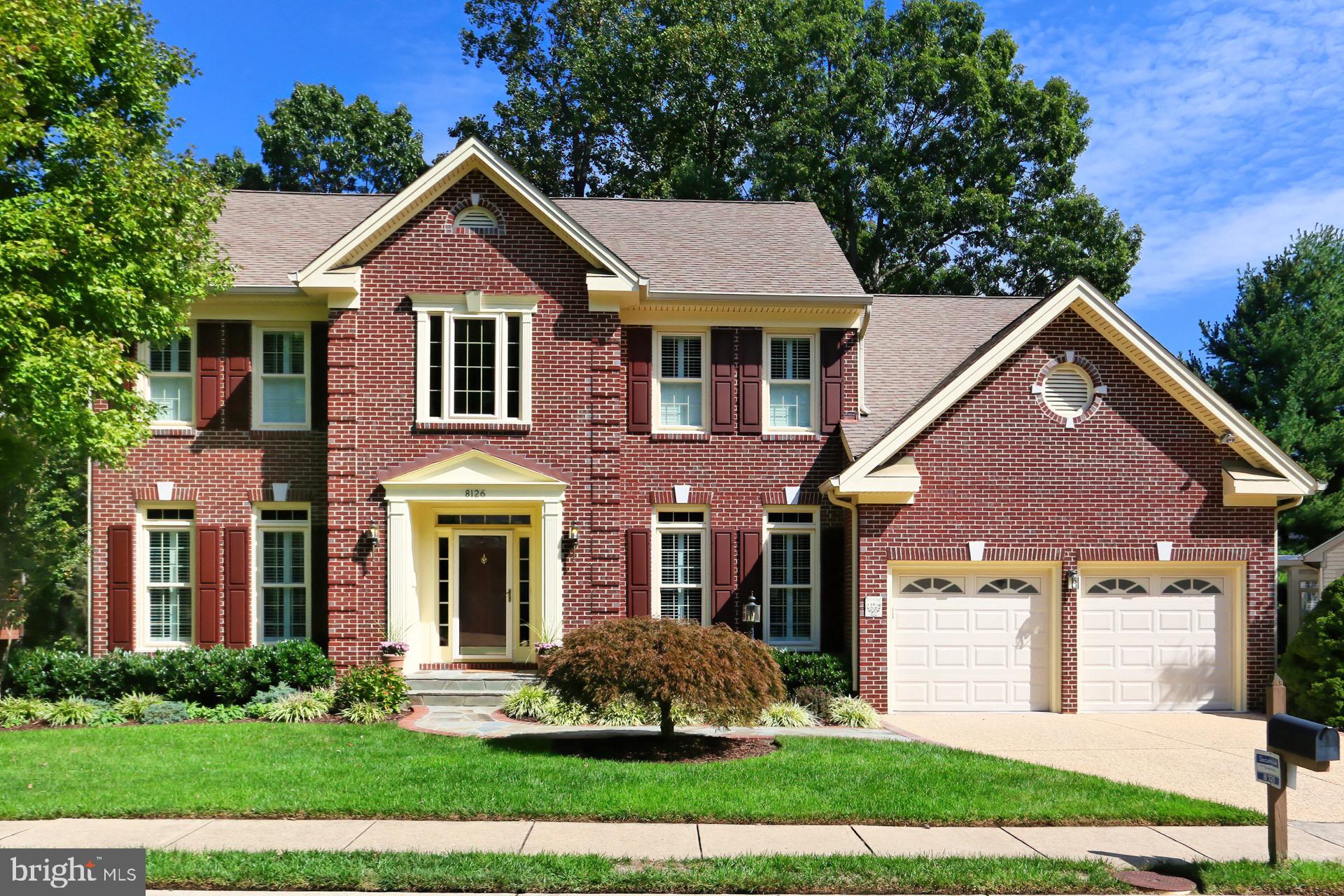 8126 Ridge Creek Way Springfield, VA 22153 - Photo 1 of 50 a front view of a house with a yard