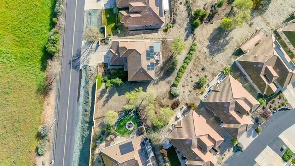 a view of a chairs and table in the balcony