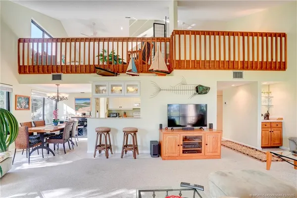 a bedroom with a large bed and a dresser