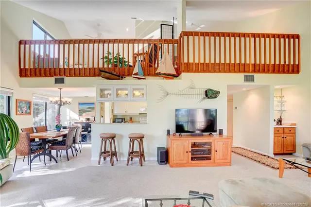 a bedroom with a large bed and a dresser