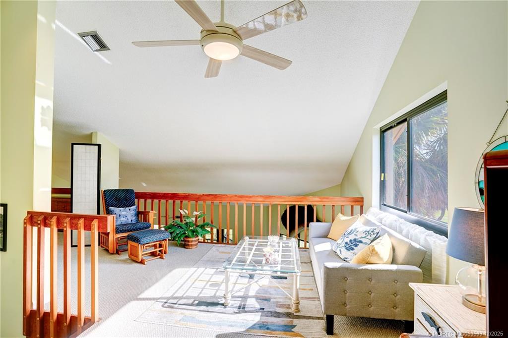 233 Northeast Edgewater Drive, Unit 204 Stuart, FL 34996 - Photo 42 of 56 a living room with furniture and a flat screen tv