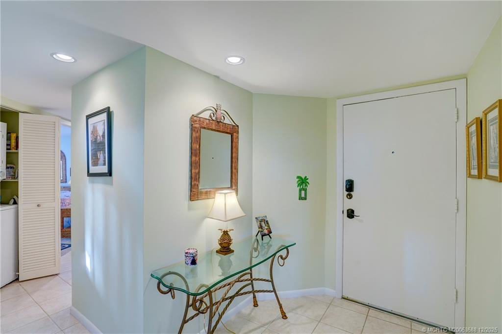 233 Northeast Edgewater Drive, Unit 204 Stuart, FL 34996 - Photo 10 of 56 a room with furniture and wooden floor