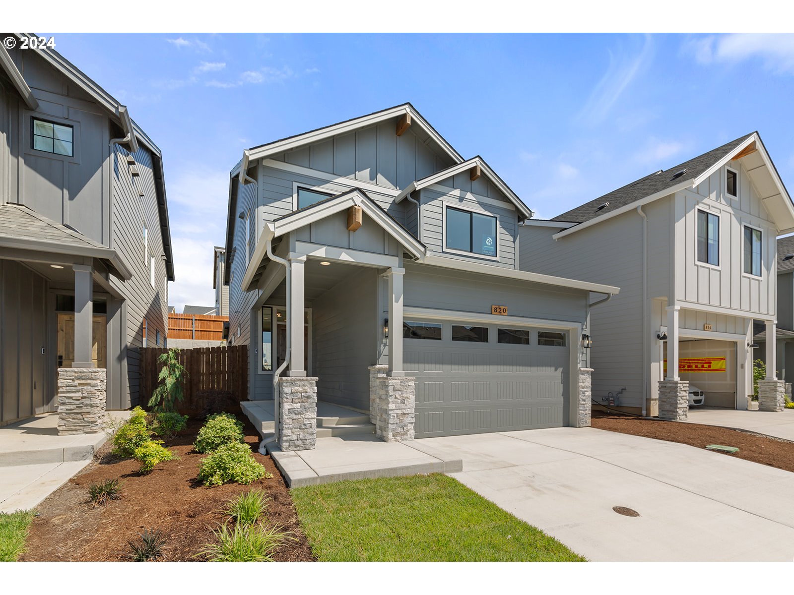 820 Northwest 178th Street Ridgefield, WA 98642 - Photo 2 of 45 a front view of a house with a yard and garage