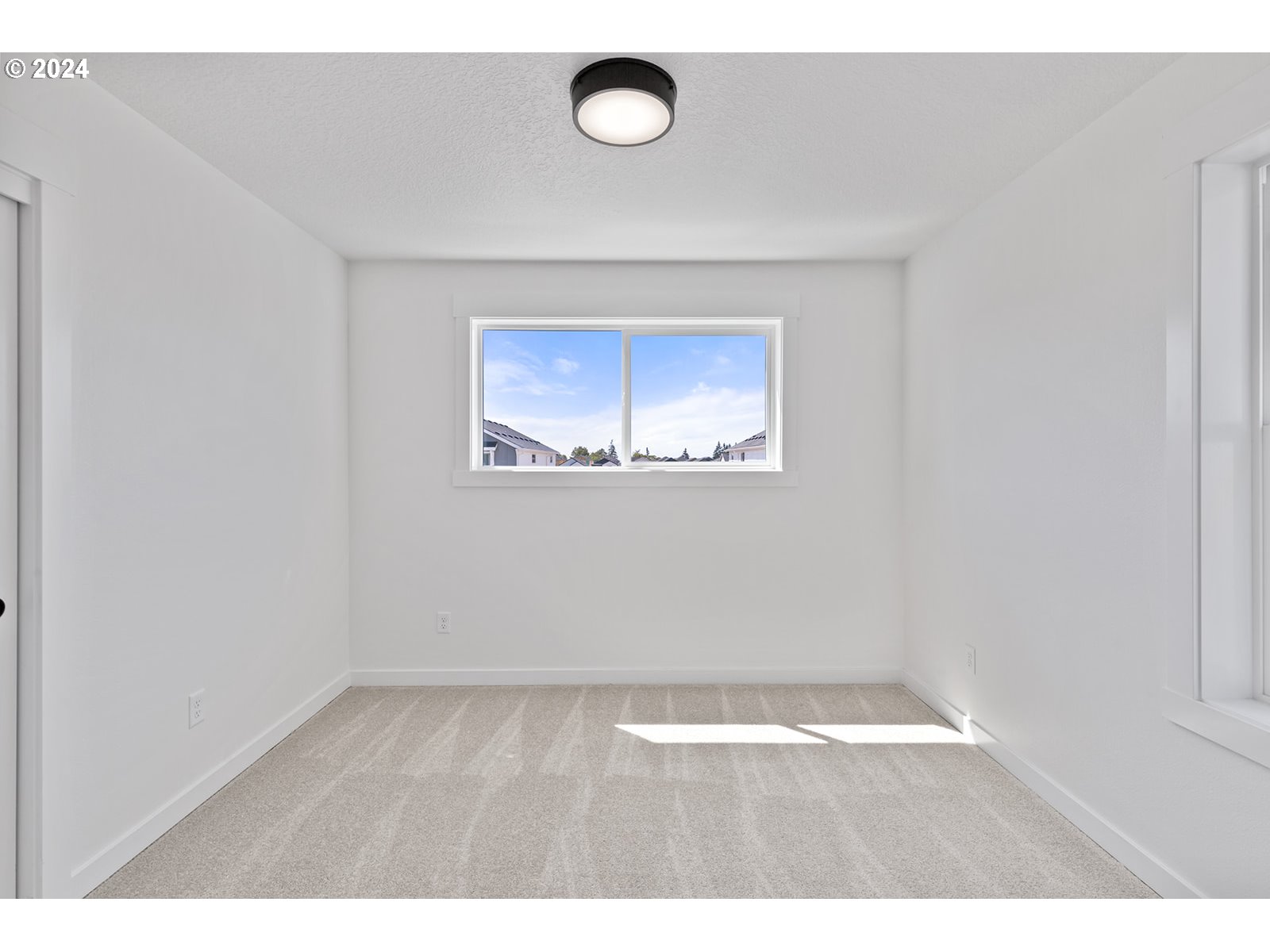 820 Northwest 178th Street Ridgefield, WA 98642 - Photo 33 of 45 a view of an empty room with a window