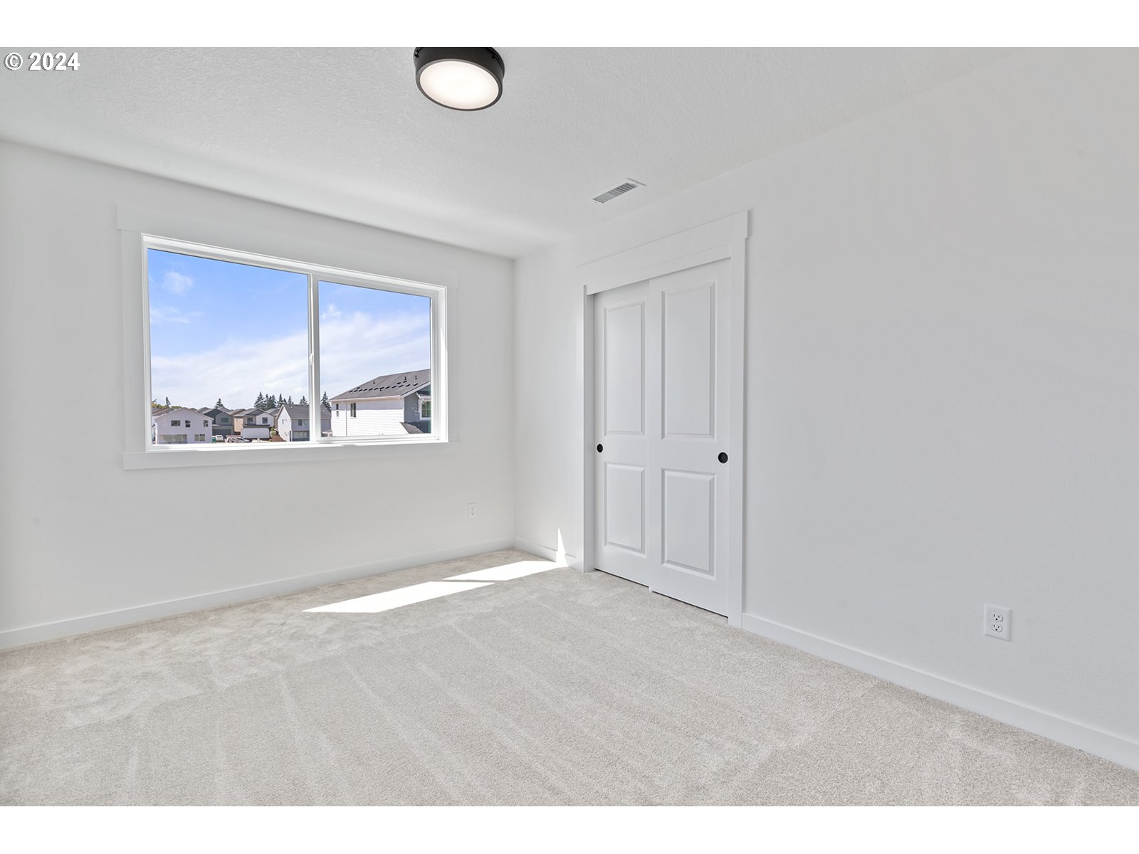 820 Northwest 178th Street Ridgefield, WA 98642 - Photo 42 of 45 a view of an empty room with a window