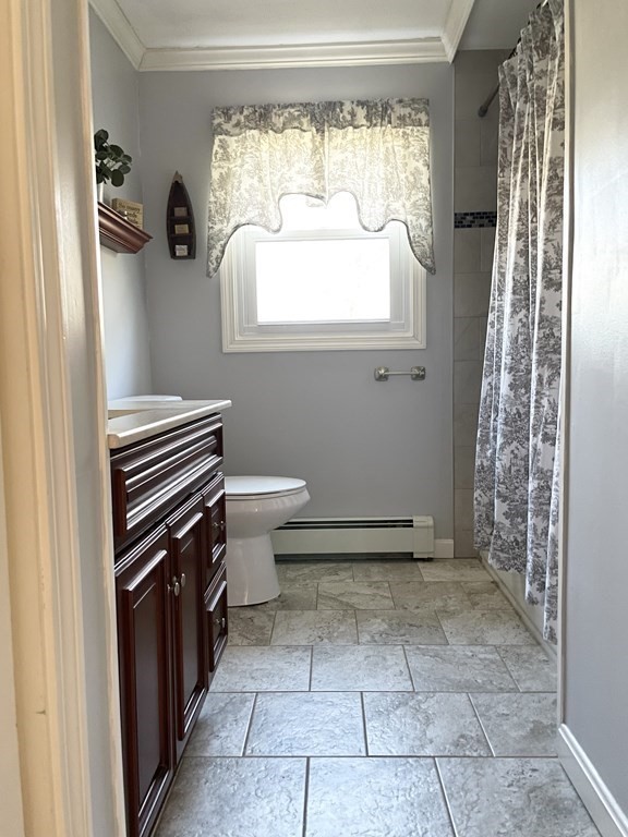 4 Vine Street Webster, MA 01570 - Photo 12 of 19 a bathroom with a sink a toilet and a window