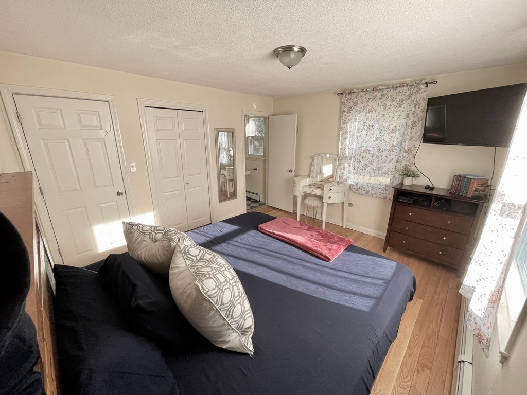 4 Vine Street Webster, MA 01570 - Photo 13 of 19 a living room with furniture and a flat screen tv