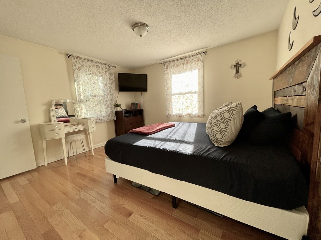 4 Vine Street Webster, MA 01570 - Photo 14 of 19 a bedroom with a bed and window