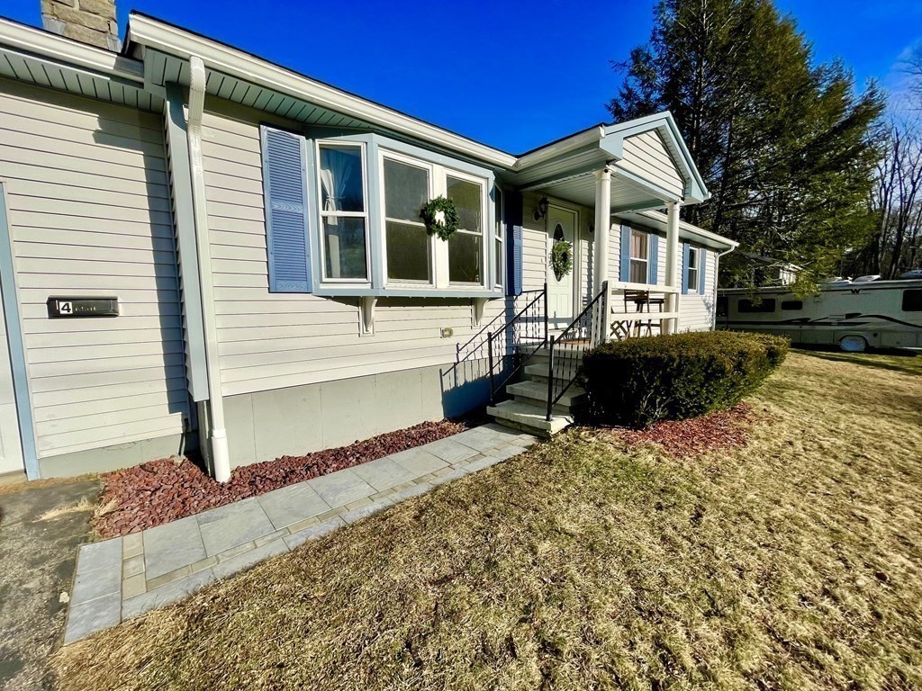 4 Vine Street Webster, MA 01570 - Photo 2 of 19 a front view of a house with a yard