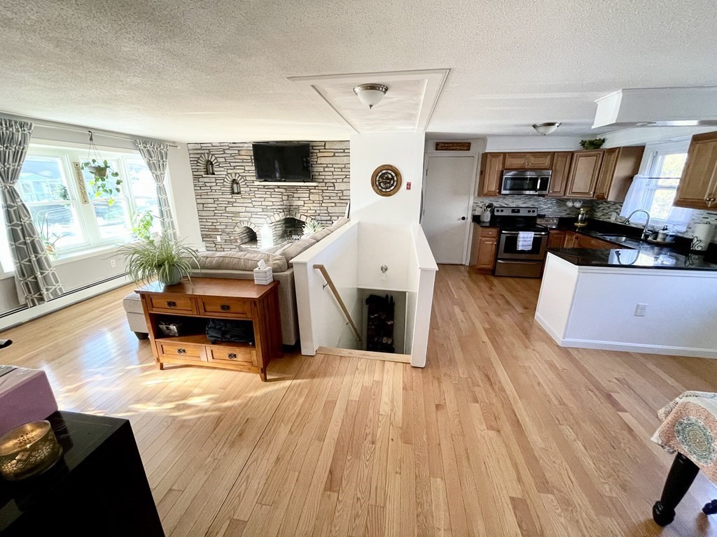 4 Vine Street Webster, MA 01570 - Photo 5 of 19 a living room with furniture and wooden floor