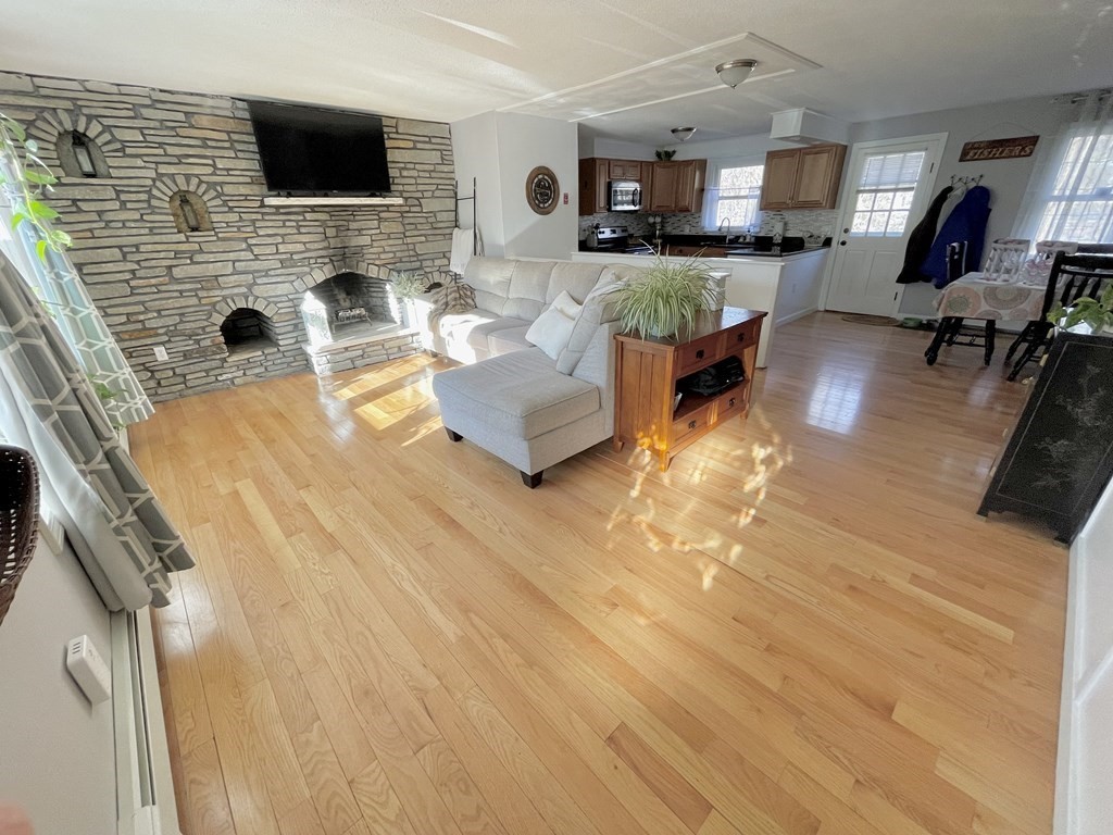 4 Vine Street Webster, MA 01570 - Photo 6 of 19 a living room with furniture and a flat screen tv