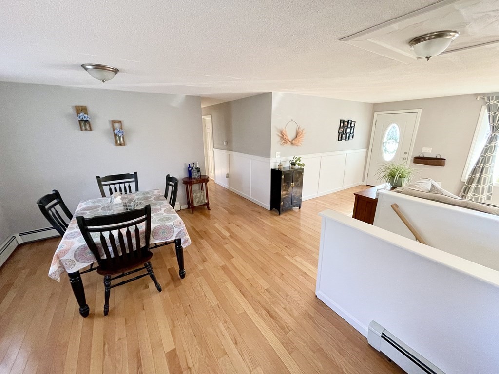 4 Vine Street Webster, MA 01570 - Photo 9 of 19 a living room with furniture and a wooden floor