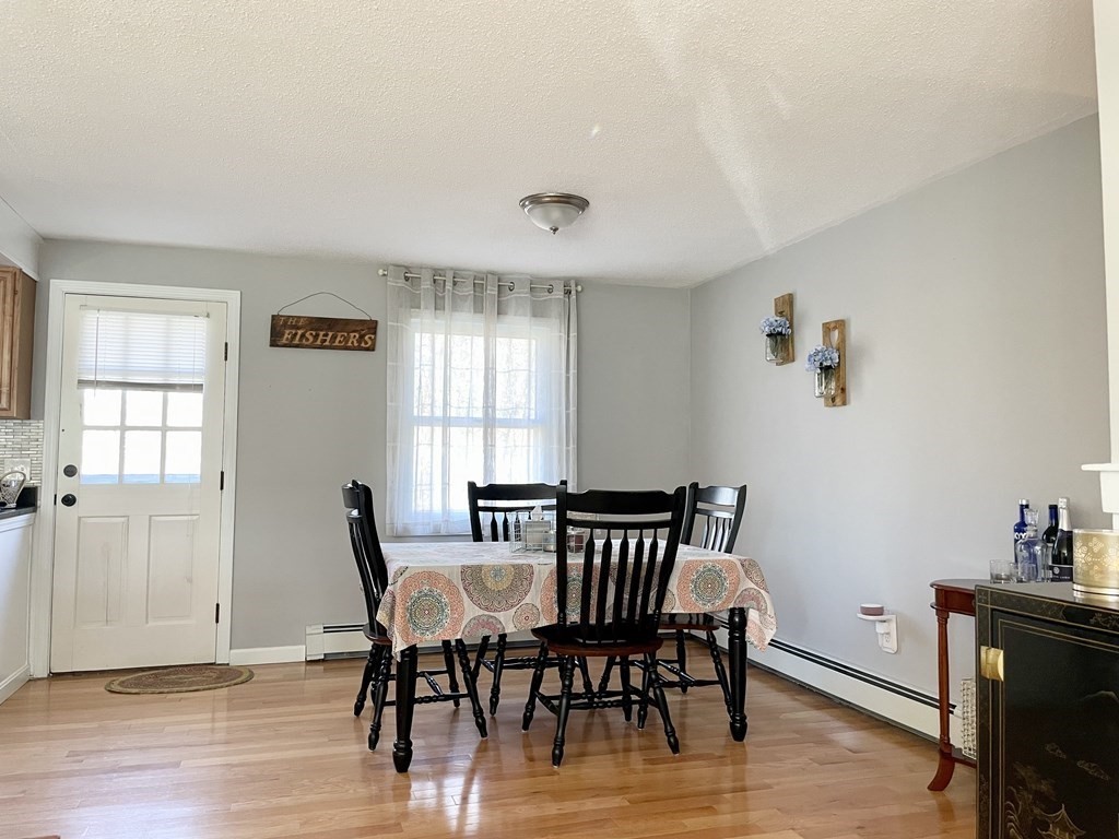 4 Vine Street Webster, MA 01570 - Photo 10 of 19 a view of a dining room with furniture window and wooden floor