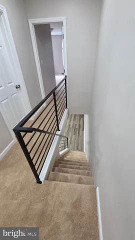 a bathroom with a sink mirror and toilet