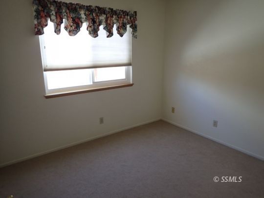 607 Plumblossom Court Ridgecrest, CA 93555 - Photo 9 of 28 an empty room with a window