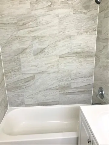 a car parked in front of a white building