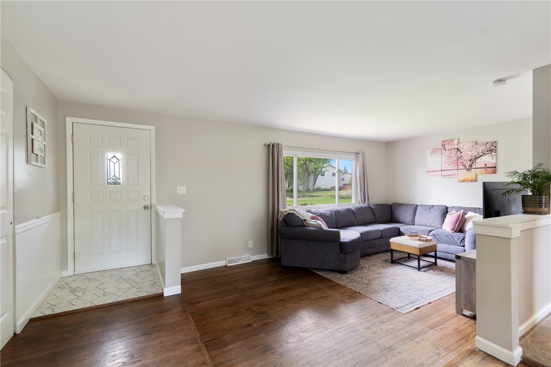 218 Kusak Road Henrietta, NY 14467 - Photo 27 of 33 Living room and tiled front door entrance.