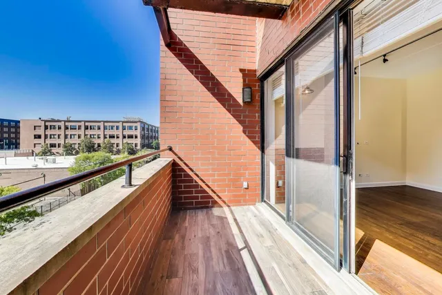 a view of balcony with wooden floor