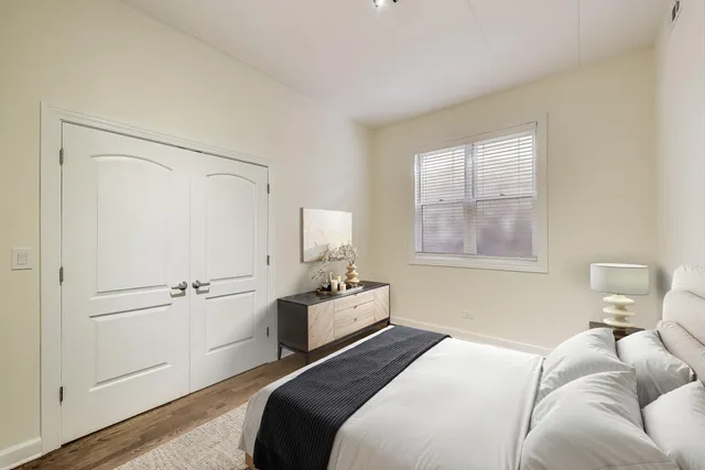 a bedroom with a bed and furniture