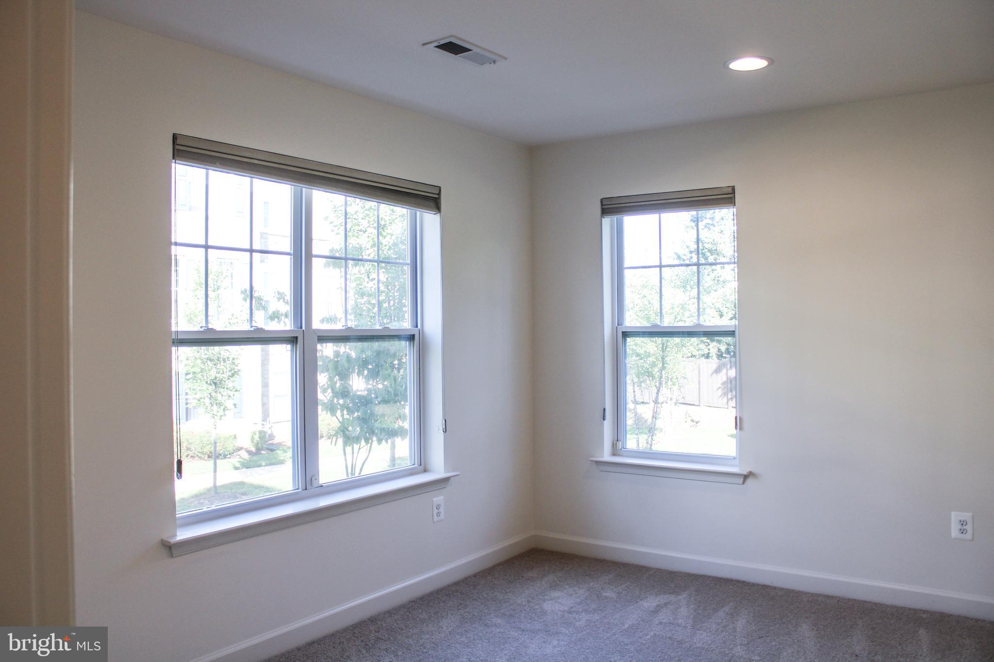 9914 Wood Edge Way Lanham, MD 20706 - Photo 17 of 67 an empty room with a window
