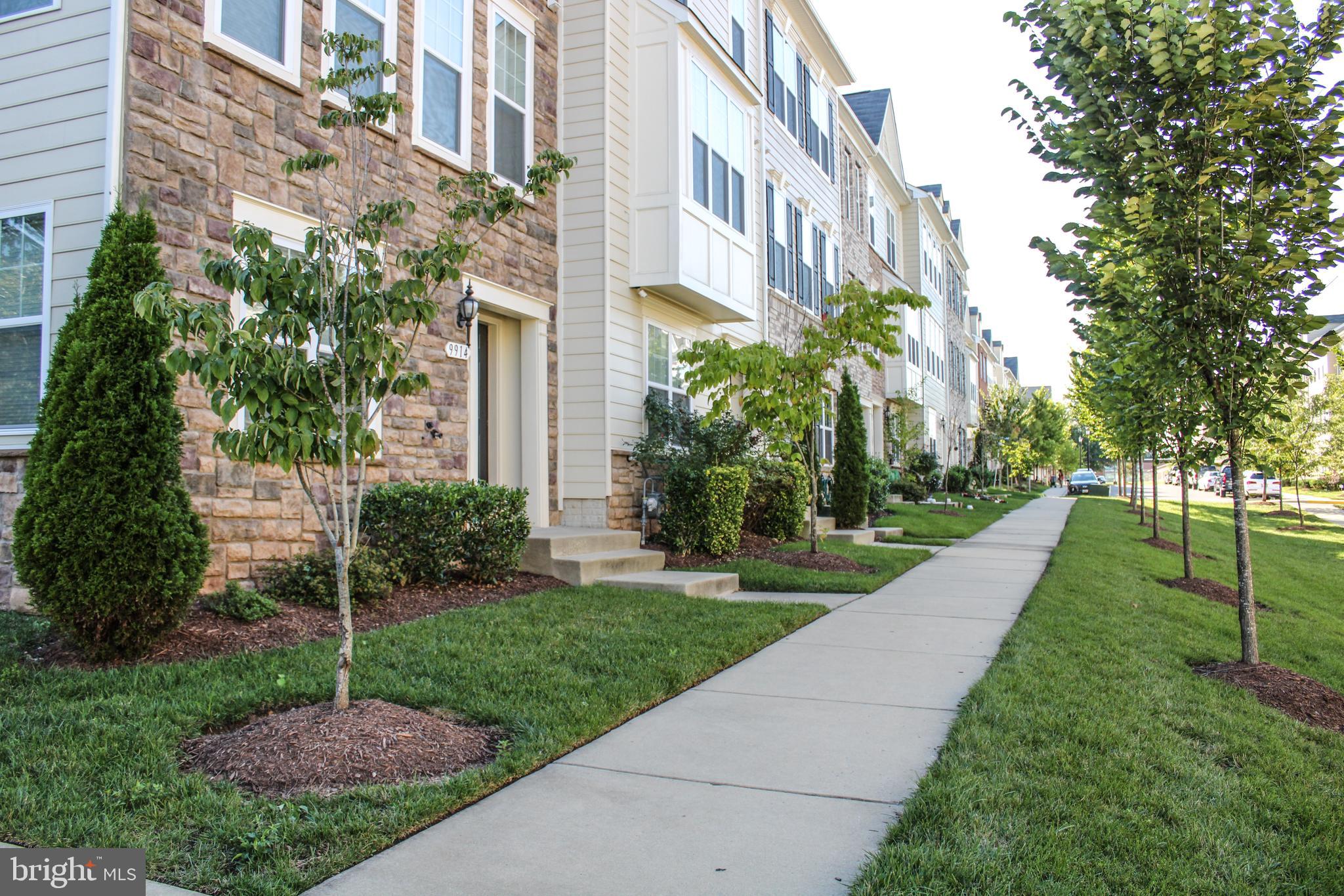 9914 Wood Edge Way Lanham, MD 20706 - Photo 2 of 67 a view of a building with a yard