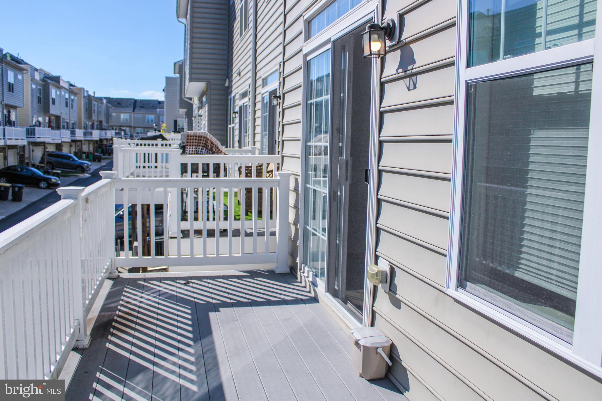 9914 Wood Edge Way Lanham, MD 20706 - Photo 23 of 67 a view of a balcony with car parked