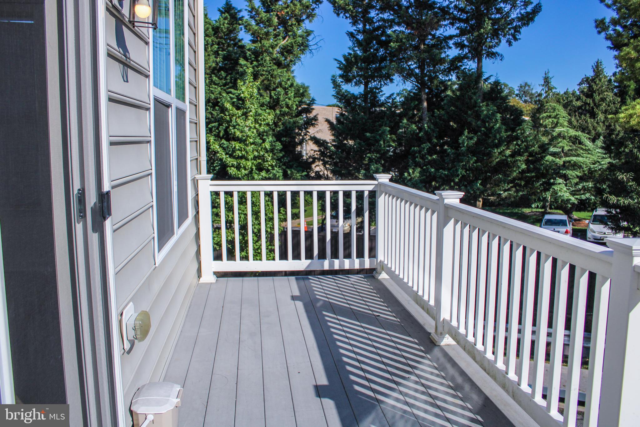 9914 Wood Edge Way Lanham, MD 20706 - Photo 24 of 67 a view of balcony with wooden floor and fence