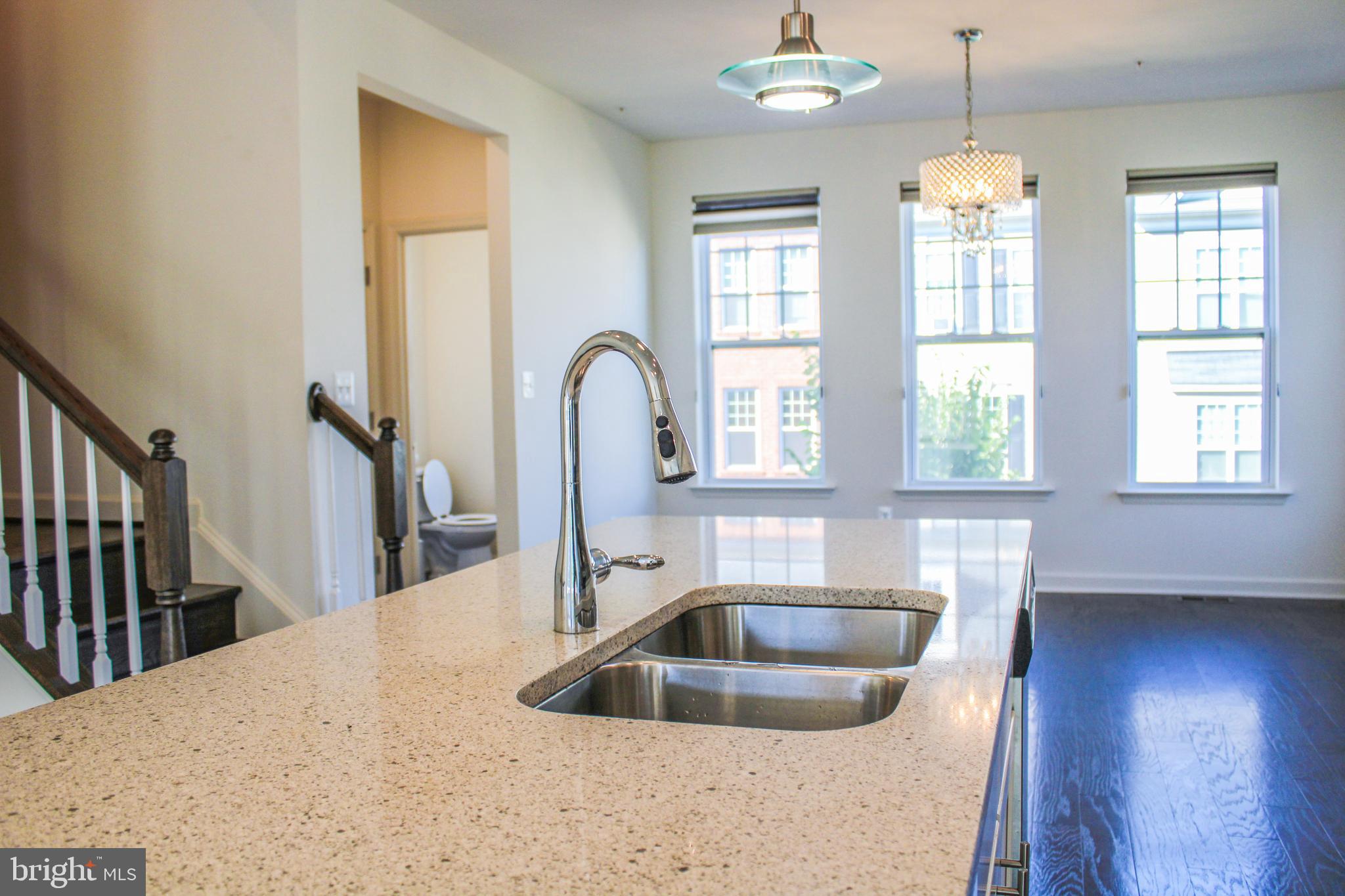 9914 Wood Edge Way Lanham, MD 20706 - Photo 27 of 67 a kitchen with sink window and dining room
