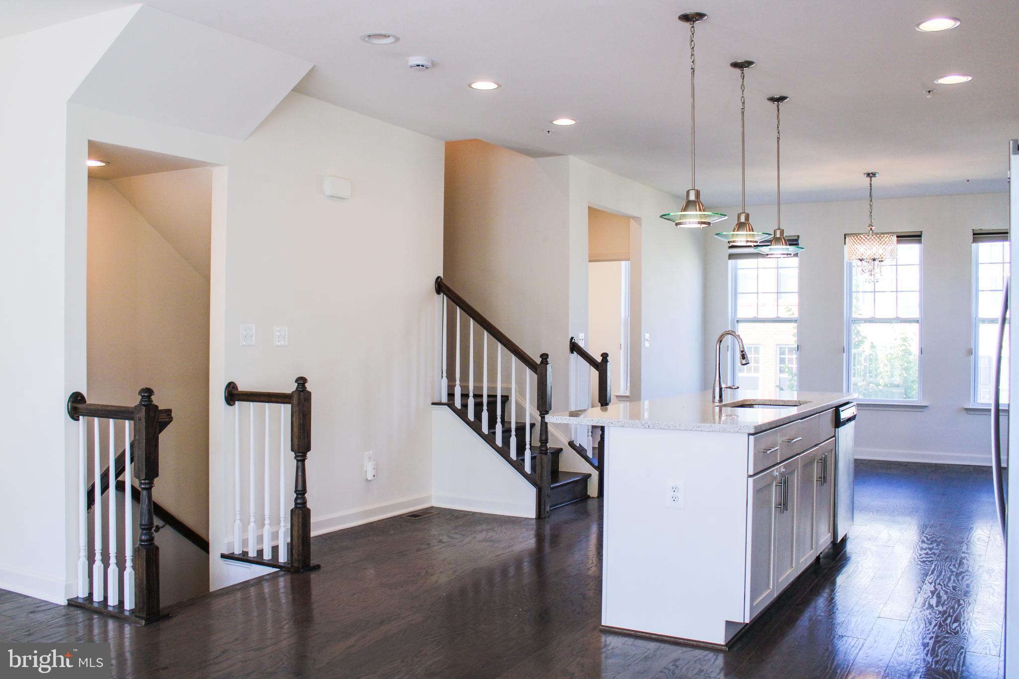 9914 Wood Edge Way Lanham, MD 20706 - Photo 28 of 67 a view of a kitchen with wooden floor and windows