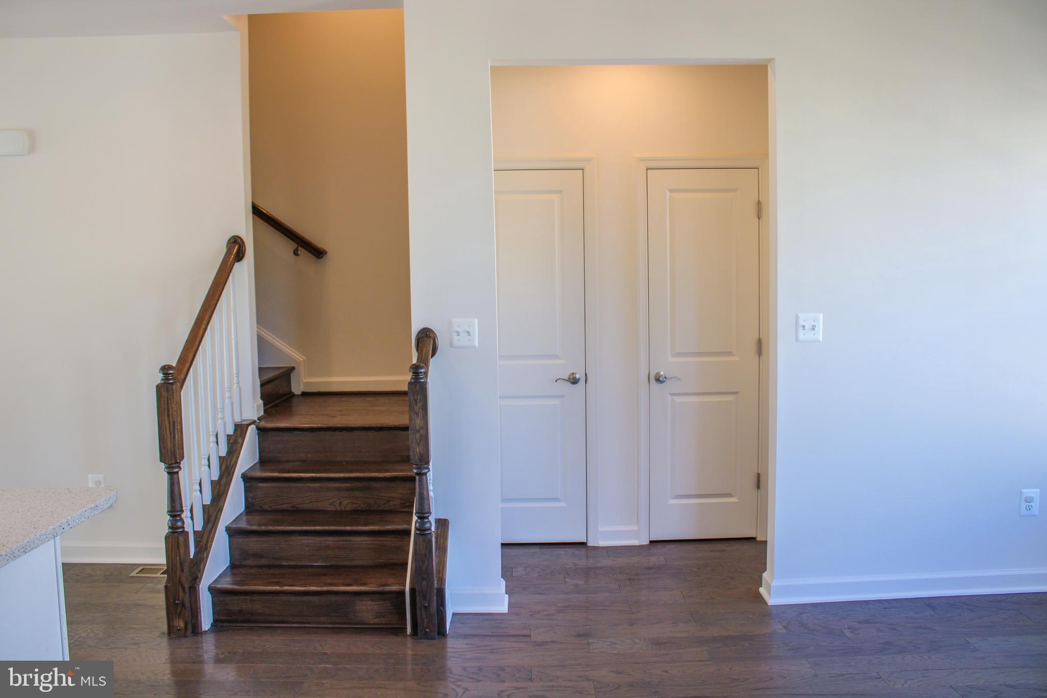 9914 Wood Edge Way Lanham, MD 20706 - Photo 36 of 67 a view of a hallway with wooden floor and entryway
