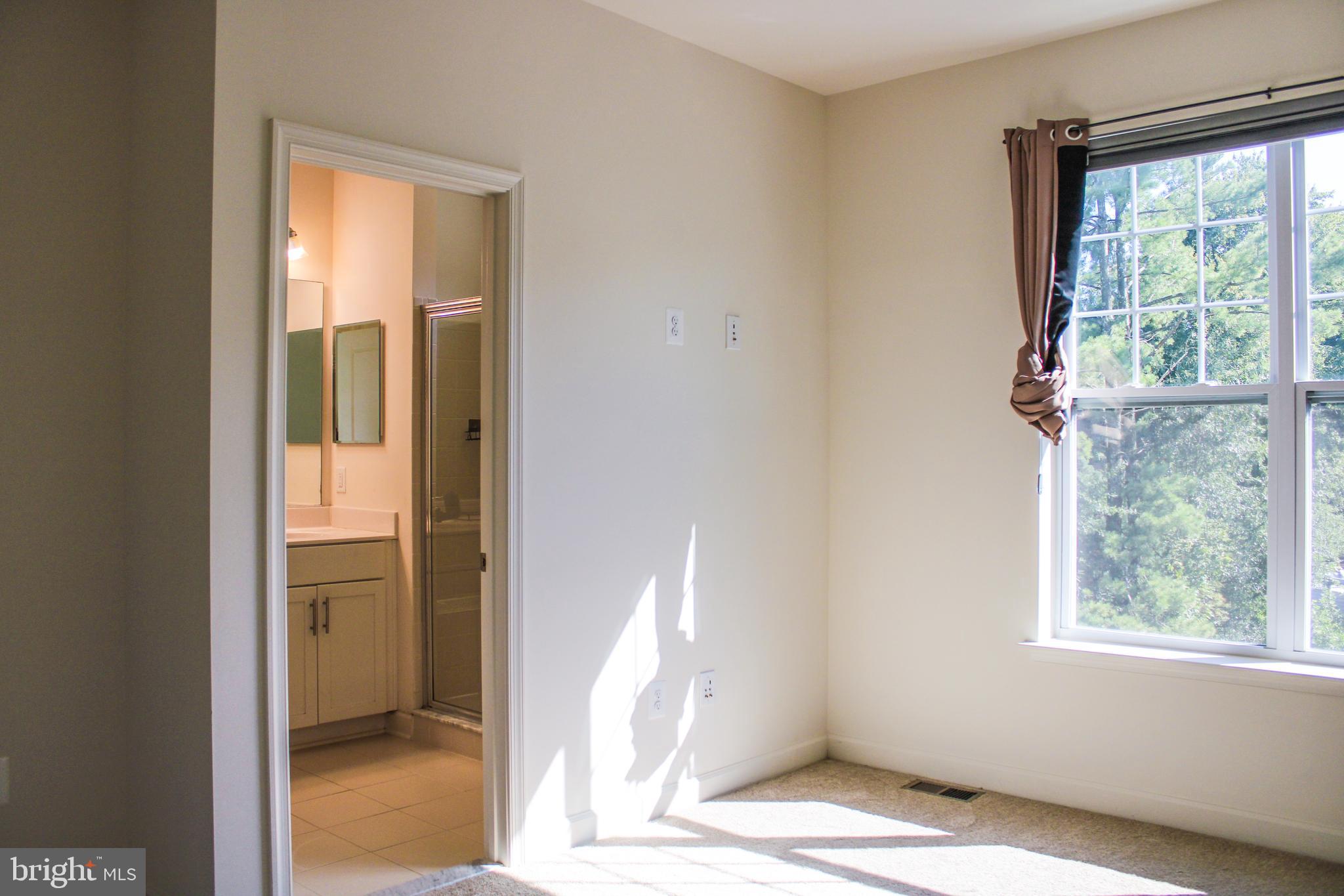 9914 Wood Edge Way Lanham, MD 20706 - Photo 40 of 67 a view of an empty room with a window