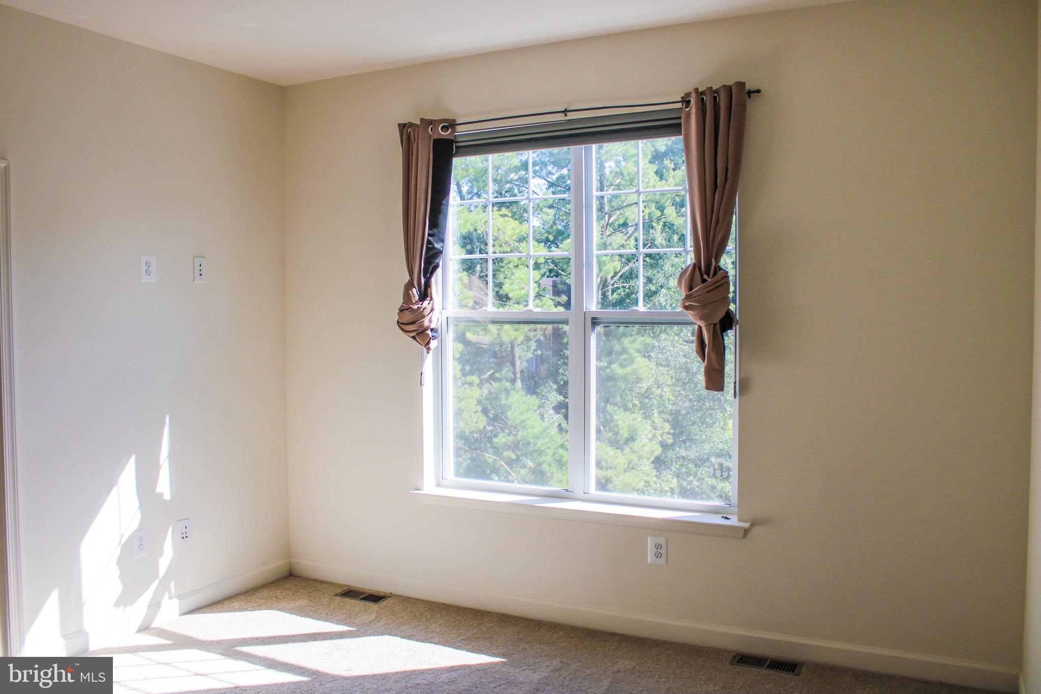 9914 Wood Edge Way Lanham, MD 20706 - Photo 41 of 67 a view of an empty room with a window