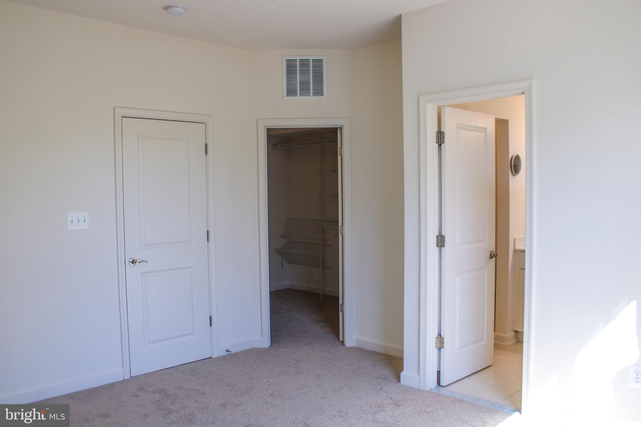 9914 Wood Edge Way Lanham, MD 20706 - Photo 42 of 67 a view of an empty room with closet and a bathroom
