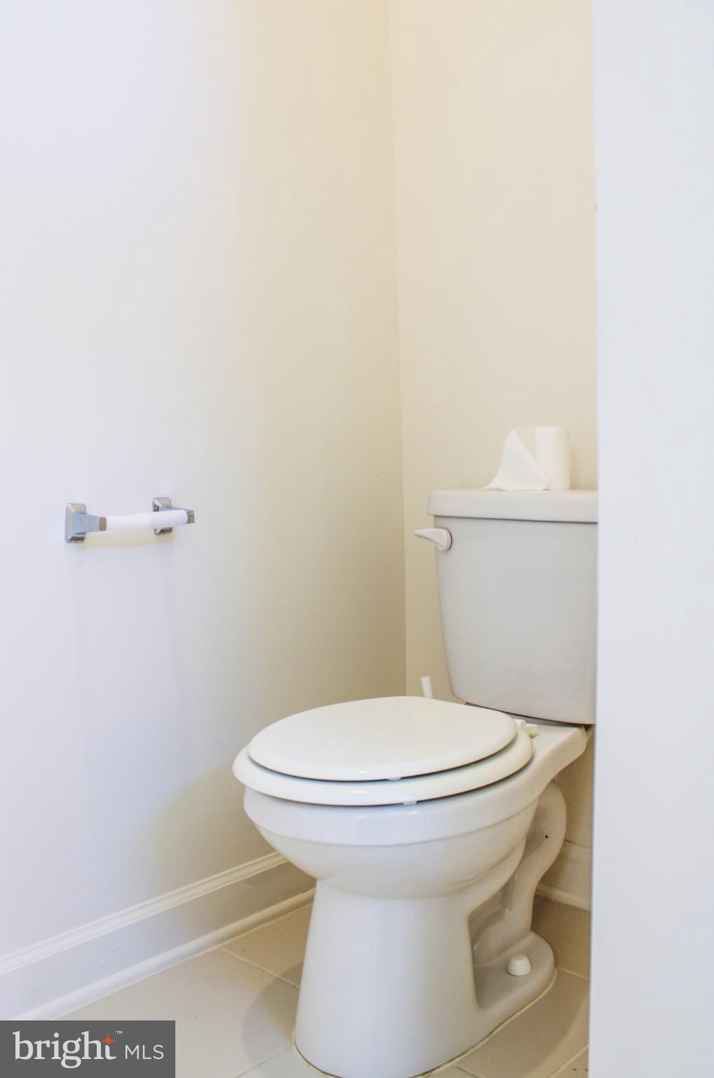 9914 Wood Edge Way Lanham, MD 20706 - Photo 43 of 67 a white toilet sitting next to a shower