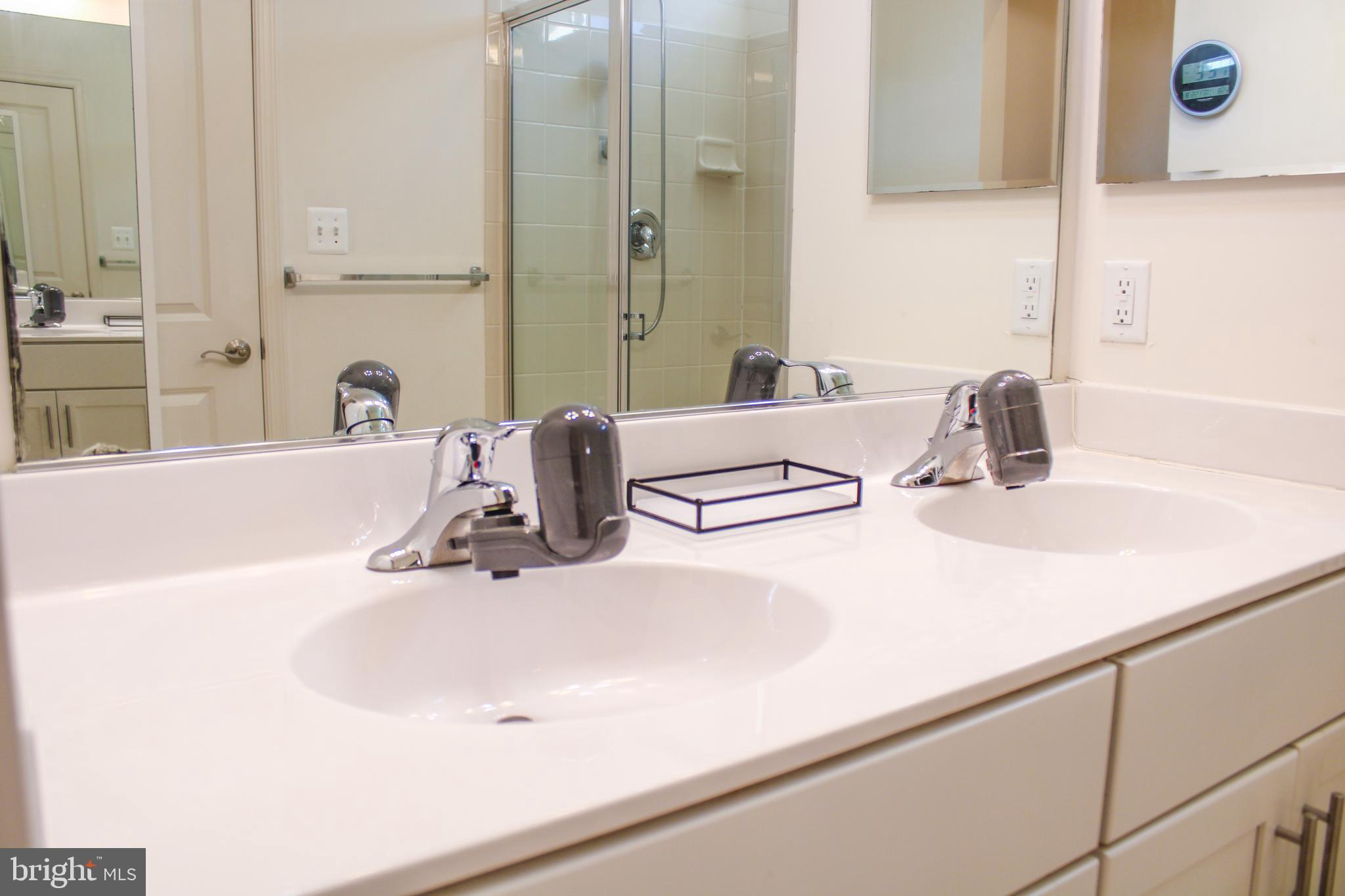 9914 Wood Edge Way Lanham, MD 20706 - Photo 44 of 67 a bathroom with a sink and a mirror