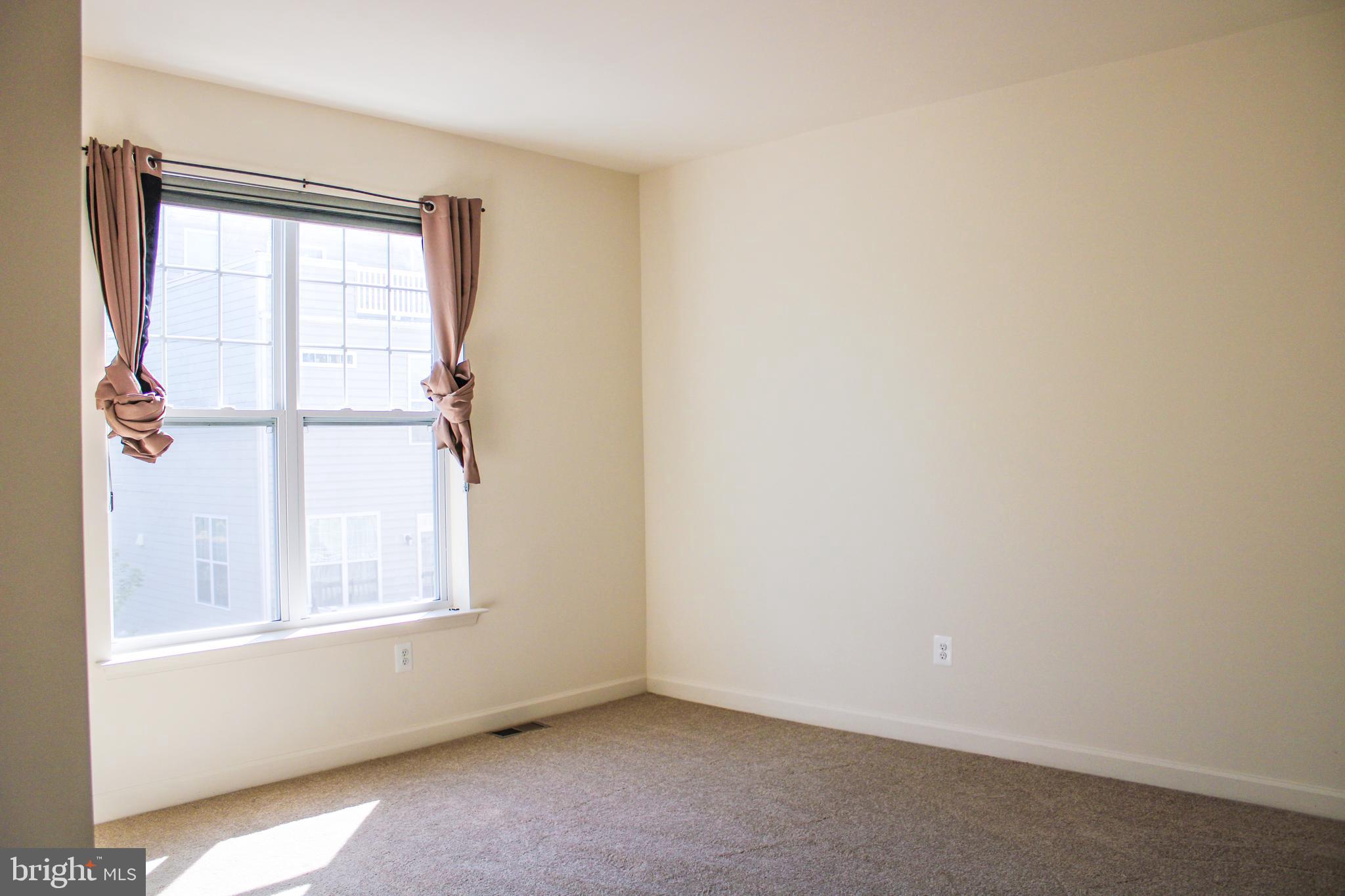 9914 Wood Edge Way Lanham, MD 20706 - Photo 49 of 67 an empty room with a window